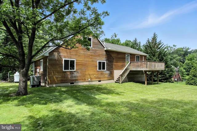 a view of a yard with swimming pool