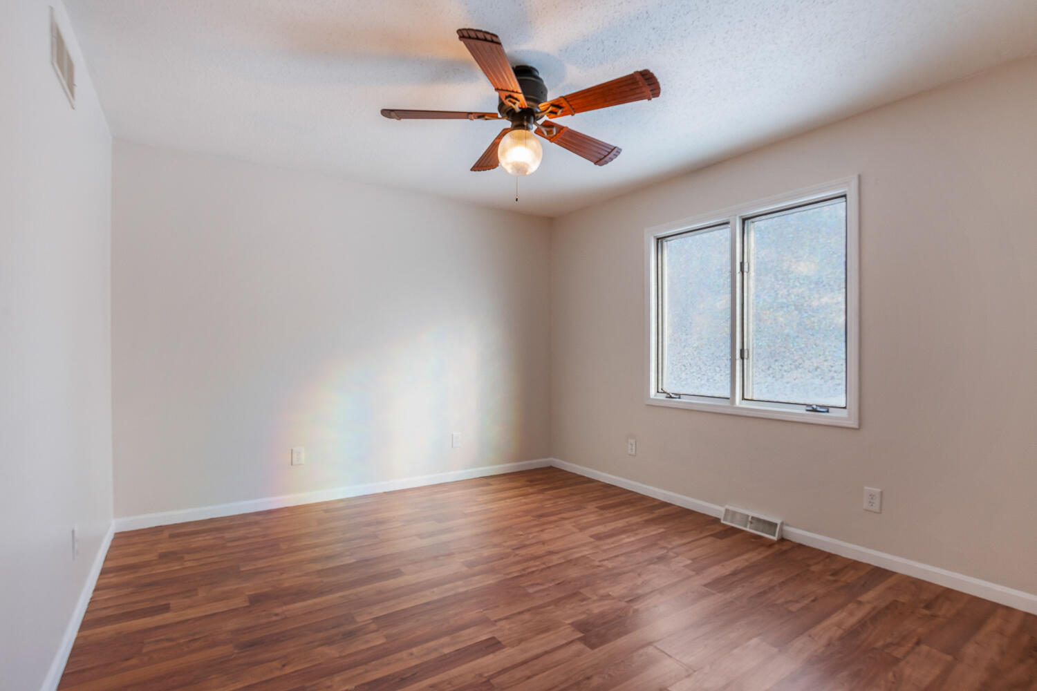 1852 South 100 West Knox, IN 46534 - Photo 8 of 13 a view of an empty room with wooden floor and a window