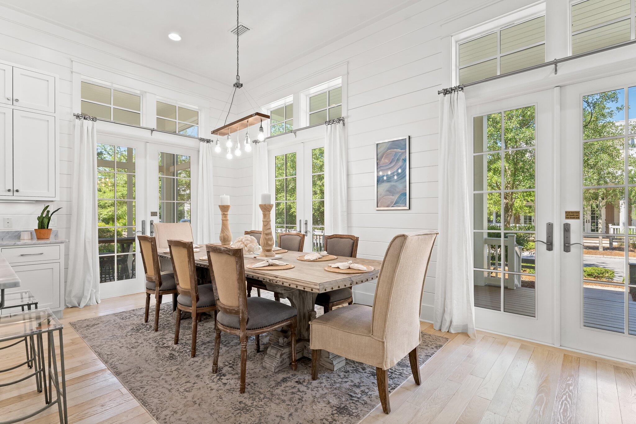 56 South Wisteria Way Santa Rosa Beach, FL 32459 - Photo 13 of 77 a view of a dining room with furniture window and wooden floor
