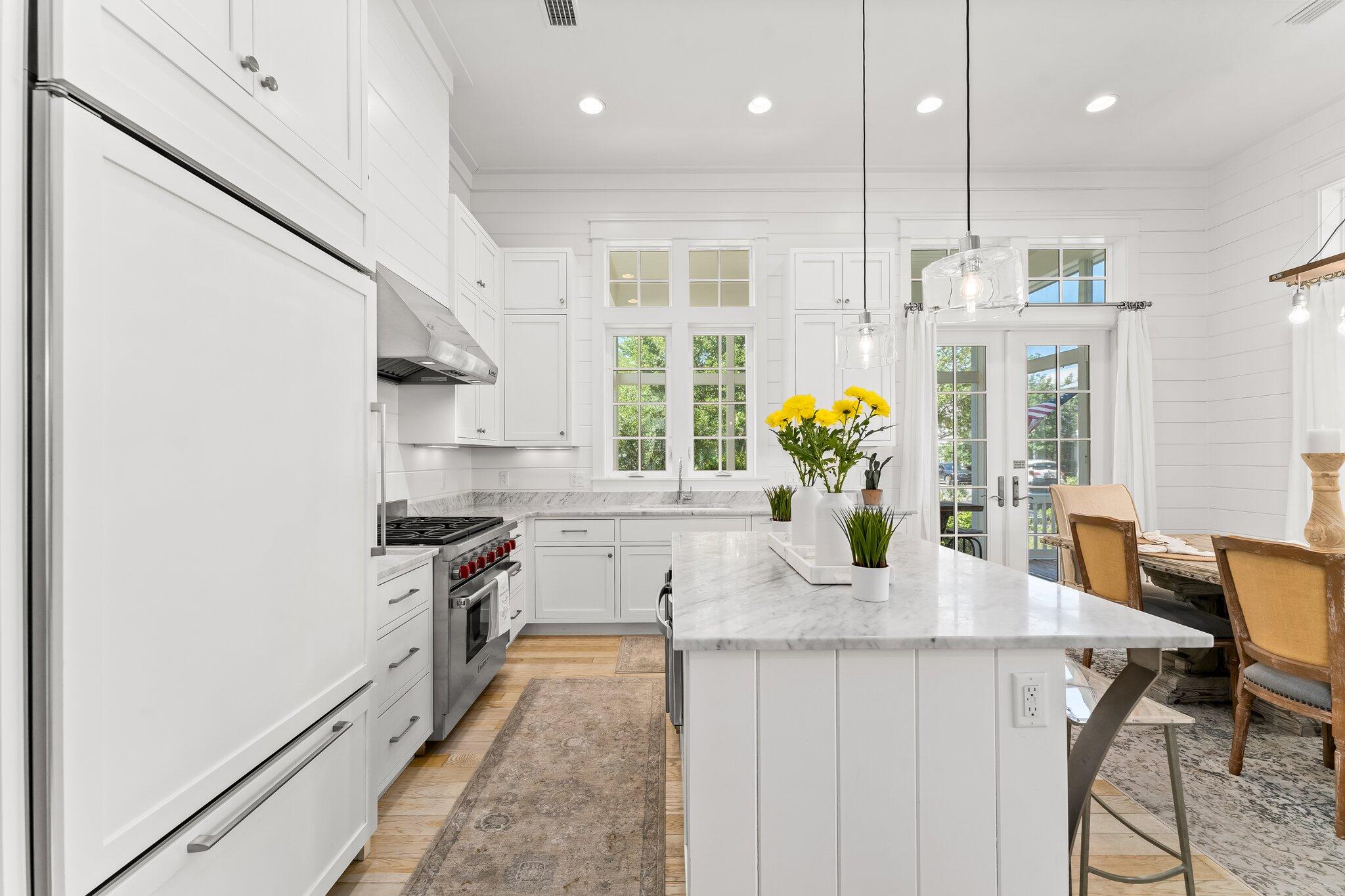 56 South Wisteria Way Santa Rosa Beach, FL 32459 - Photo 16 of 77 a kitchen with stainless steel appliances granite countertop a sink a stove and a wooden floors