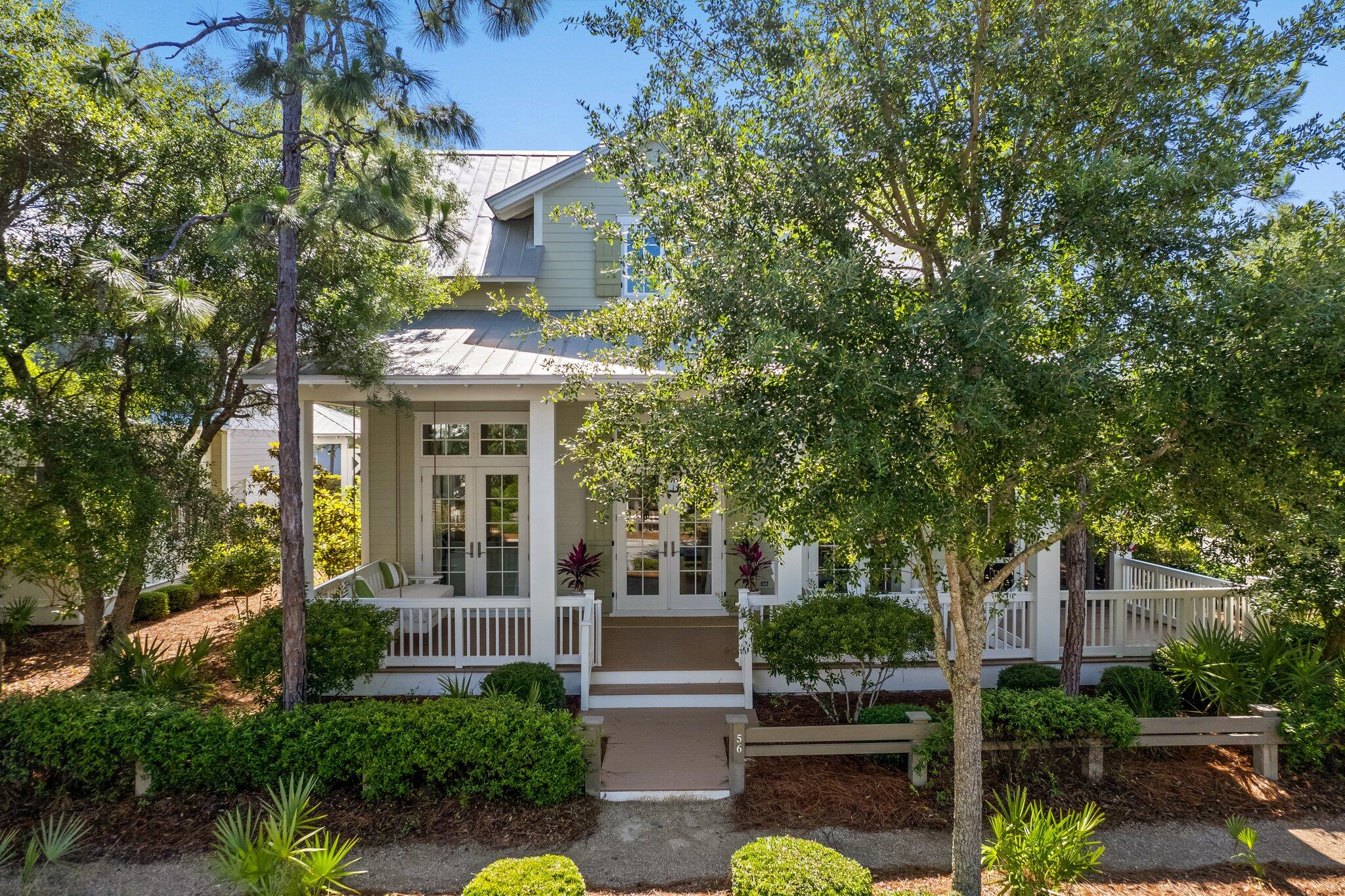 56 South Wisteria Way Santa Rosa Beach, FL 32459 - Photo 2 of 77 front view of a house with a garden