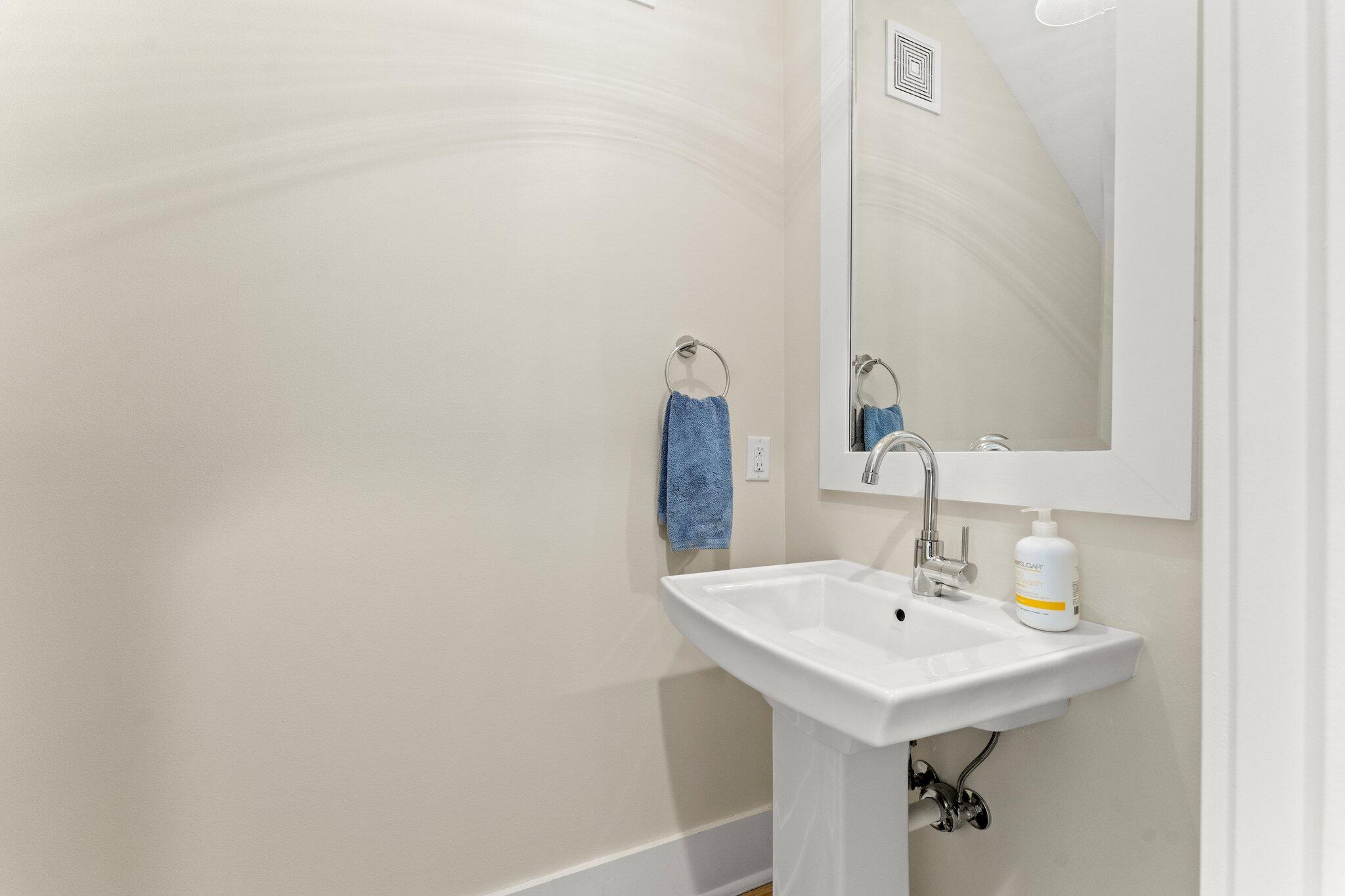 56 South Wisteria Way Santa Rosa Beach, FL 32459 - Photo 22 of 77 a bathroom with a sink and a mirror