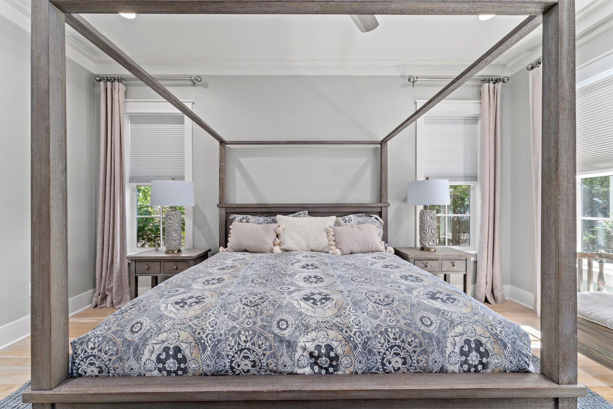 56 South Wisteria Way Santa Rosa Beach, FL 32459 - Photo 24 of 77 a large white bed in a white room next to a window