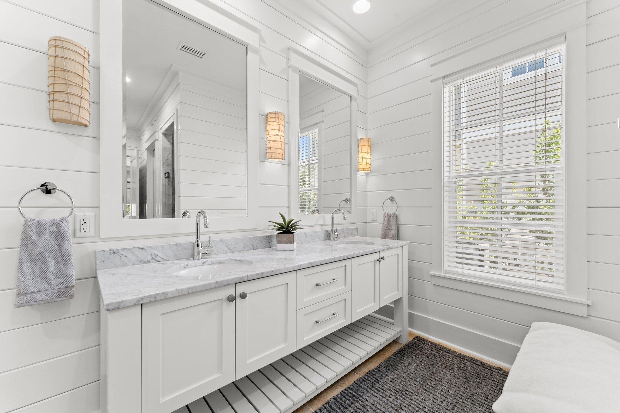 56 South Wisteria Way Santa Rosa Beach, FL 32459 - Photo 28 of 77 a bathroom with double vanity and a mirror