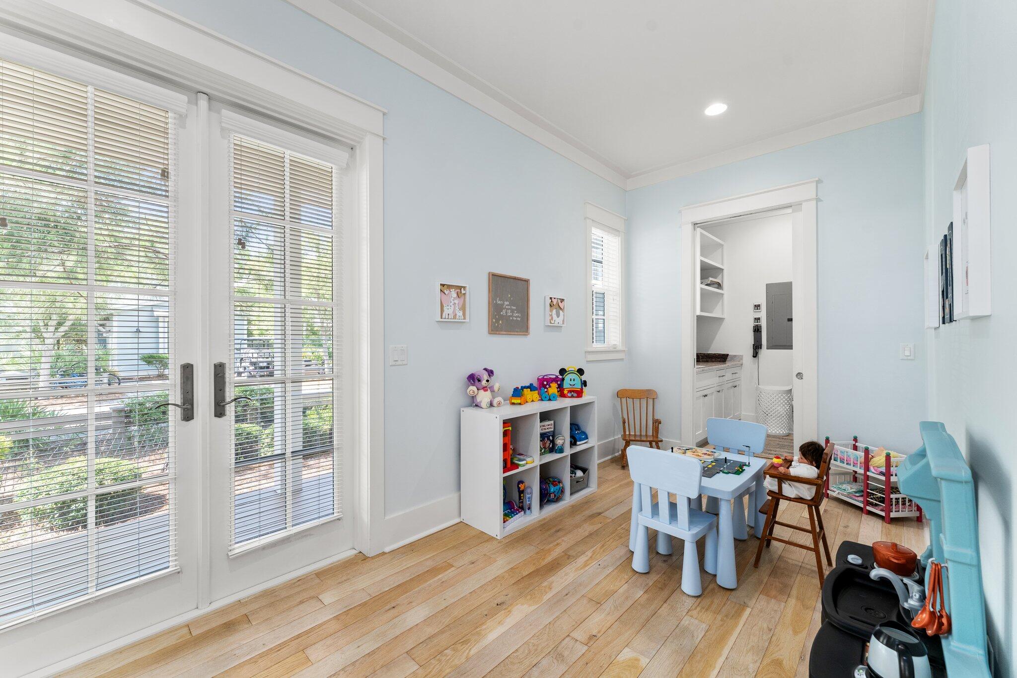 56 South Wisteria Way Santa Rosa Beach, FL 32459 - Photo 30 of 77 a view of a dining room with furniture and wooden floor