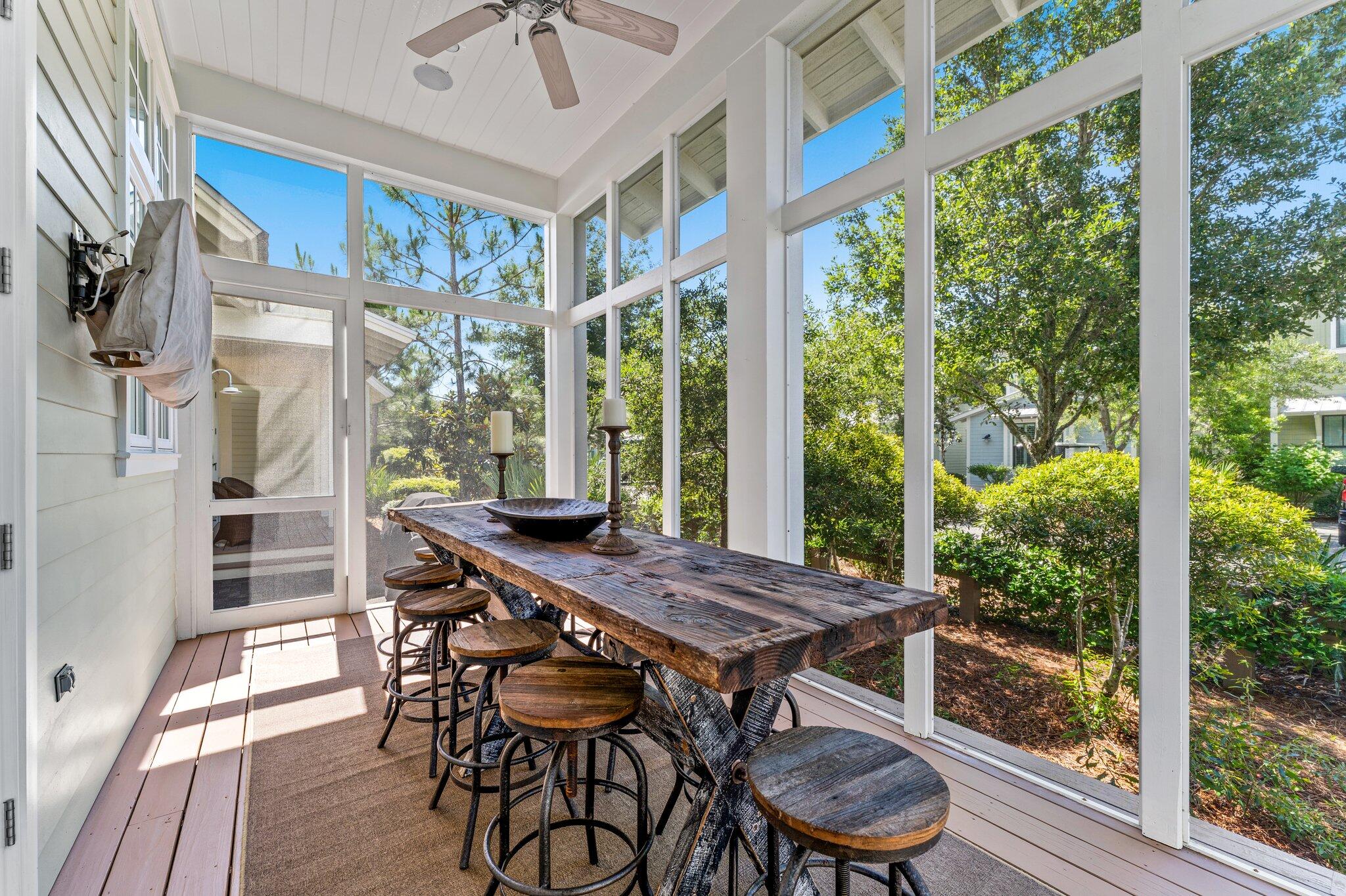 56 South Wisteria Way Santa Rosa Beach, FL 32459 - Photo 35 of 77 a view of a patio with a table chairs and backyard