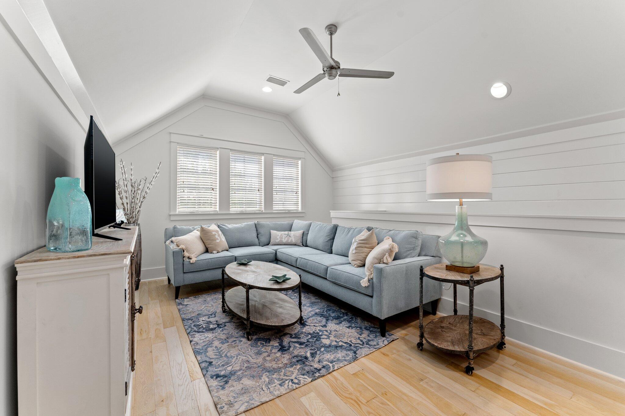 56 South Wisteria Way Santa Rosa Beach, FL 32459 - Photo 38 of 77 a living room with furniture and a flat screen tv