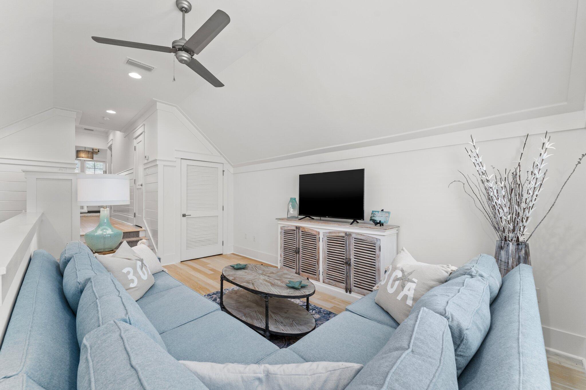 56 South Wisteria Way Santa Rosa Beach, FL 32459 - Photo 39 of 77 a living room with furniture and a flat screen tv