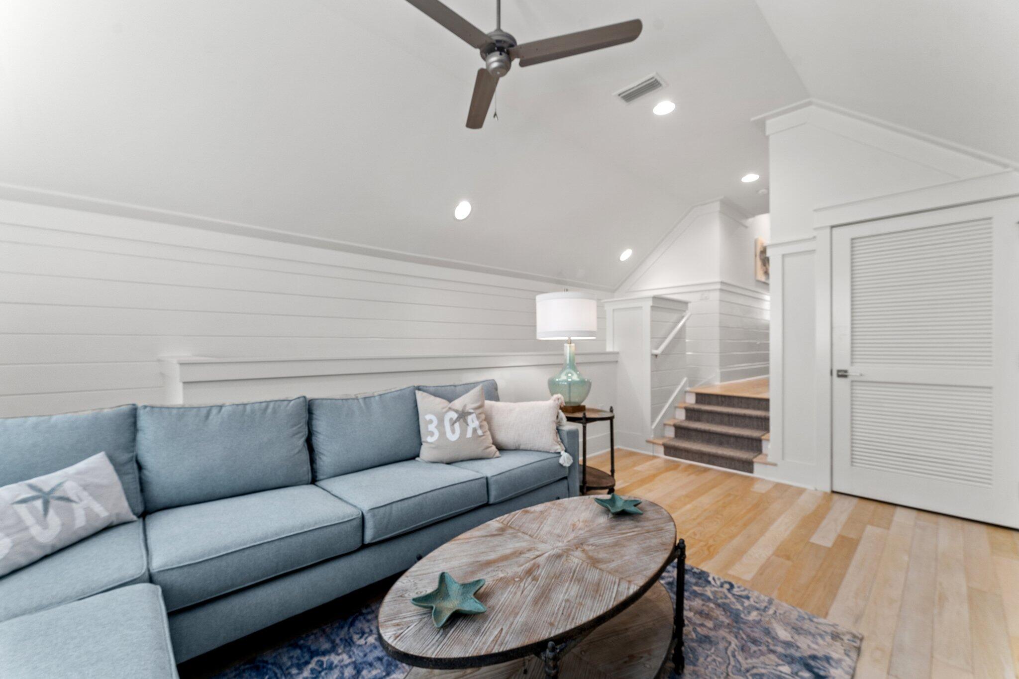 56 South Wisteria Way Santa Rosa Beach, FL 32459 - Photo 40 of 77 a living room with furniture and a wooden floor