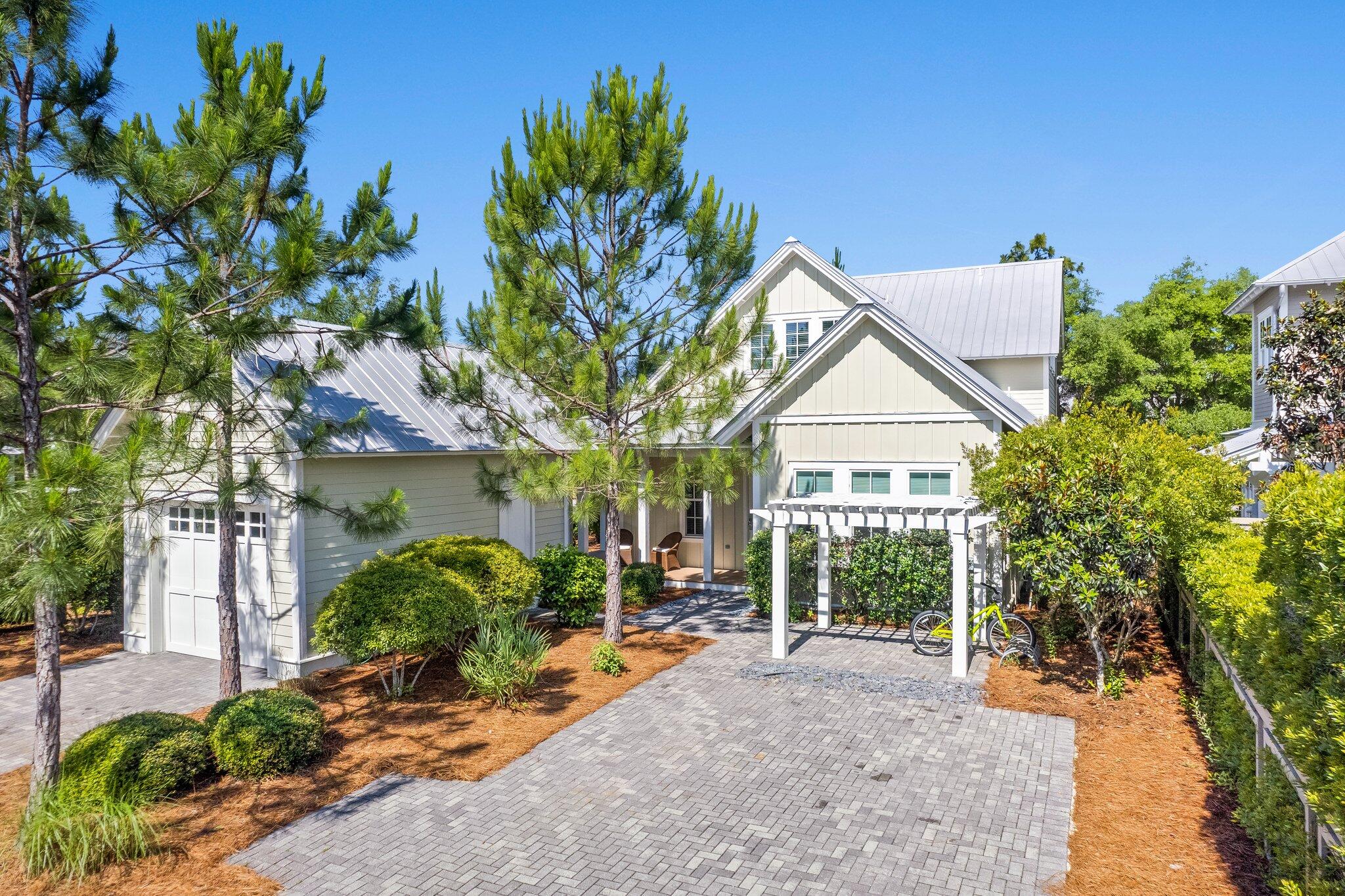 56 South Wisteria Way Santa Rosa Beach, FL 32459 - Photo 4 of 77 a view of a house with a tree and plants