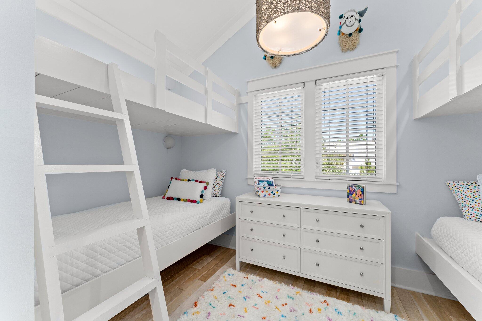 56 South Wisteria Way Santa Rosa Beach, FL 32459 - Photo 43 of 77 a bedroom with a bed and a dresser