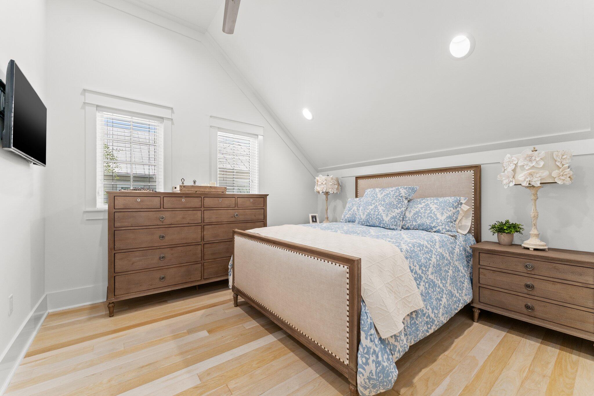 56 South Wisteria Way Santa Rosa Beach, FL 32459 - Photo 47 of 77 a bedroom with a bed and a flat screen tv