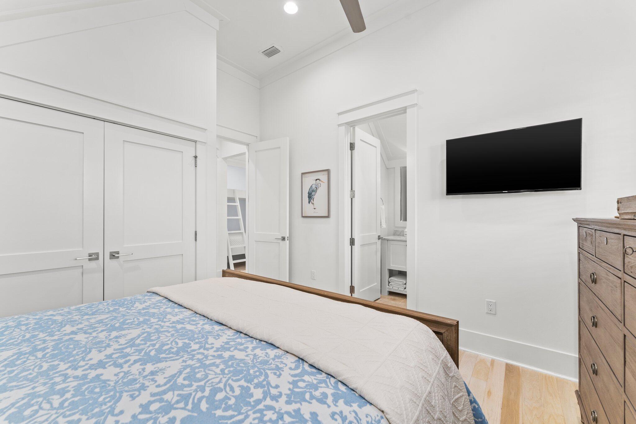 56 South Wisteria Way Santa Rosa Beach, FL 32459 - Photo 48 of 77 a bedroom with a bed and a flat screen tv