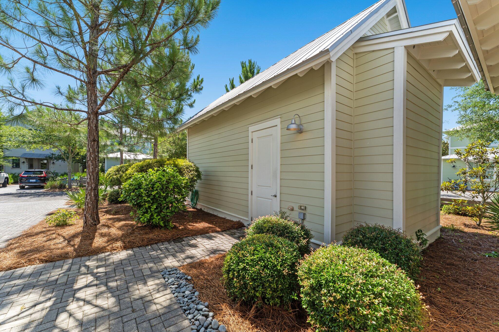 56 South Wisteria Way Santa Rosa Beach, FL 32459 - Photo 51 of 77 a backyard of a house with plants and tree