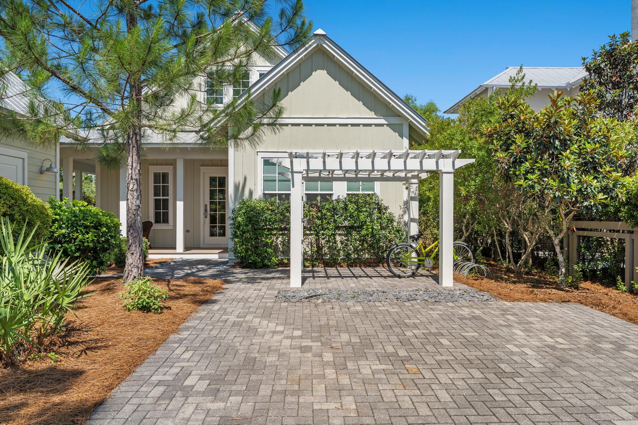 56 South Wisteria Way Santa Rosa Beach, FL 32459 - Photo 53 of 77 a view of house with yard and glass windows