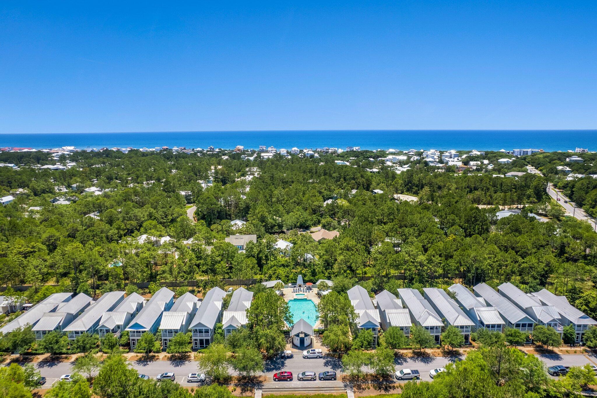 56 South Wisteria Way Santa Rosa Beach, FL 32459 - Photo 63 of 77 an aerial view of residential houses with outdoor space and trees