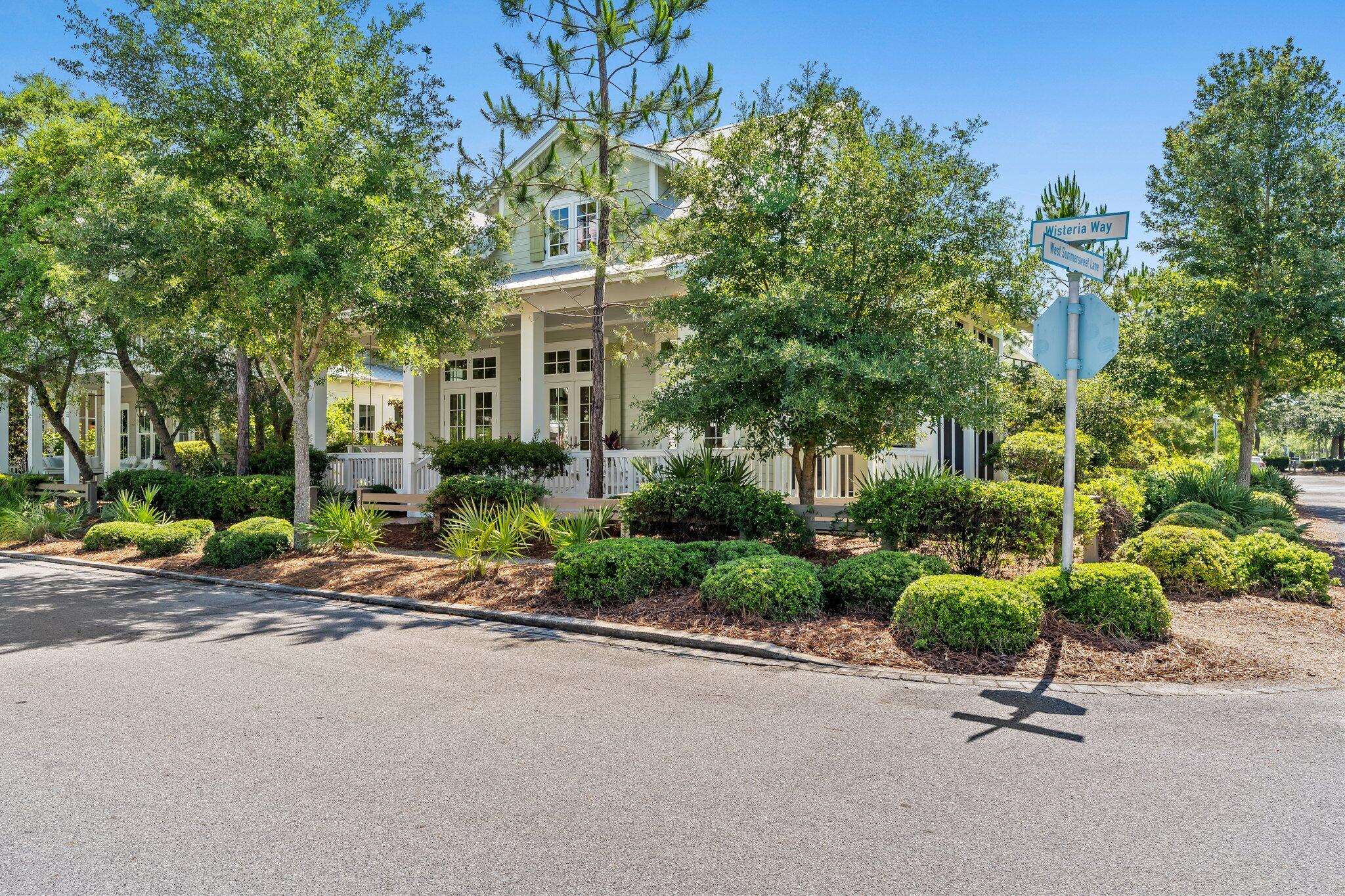 56 South Wisteria Way Santa Rosa Beach, FL 32459 - Photo 8 of 77 a view of a street with a couple of cars parked in front of it