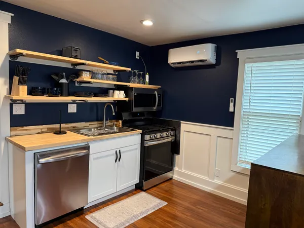 a kitchen with a stove and a refrigerator