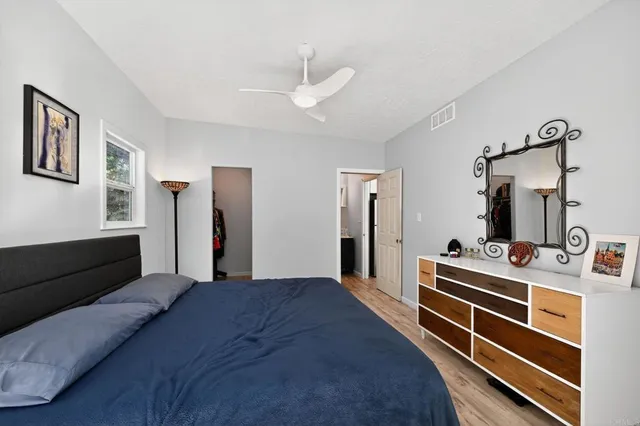 a bed room with bed and window