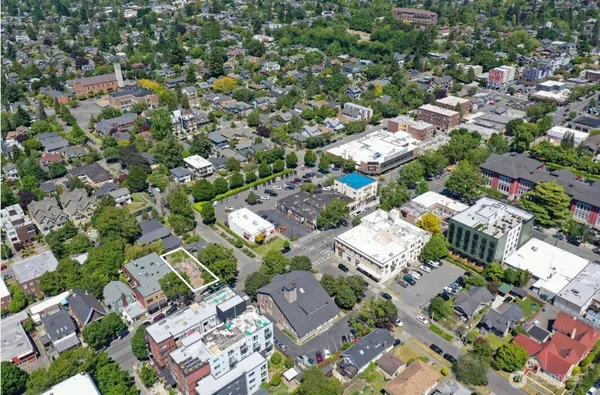 an aerial view of residential houses with outdoor space
