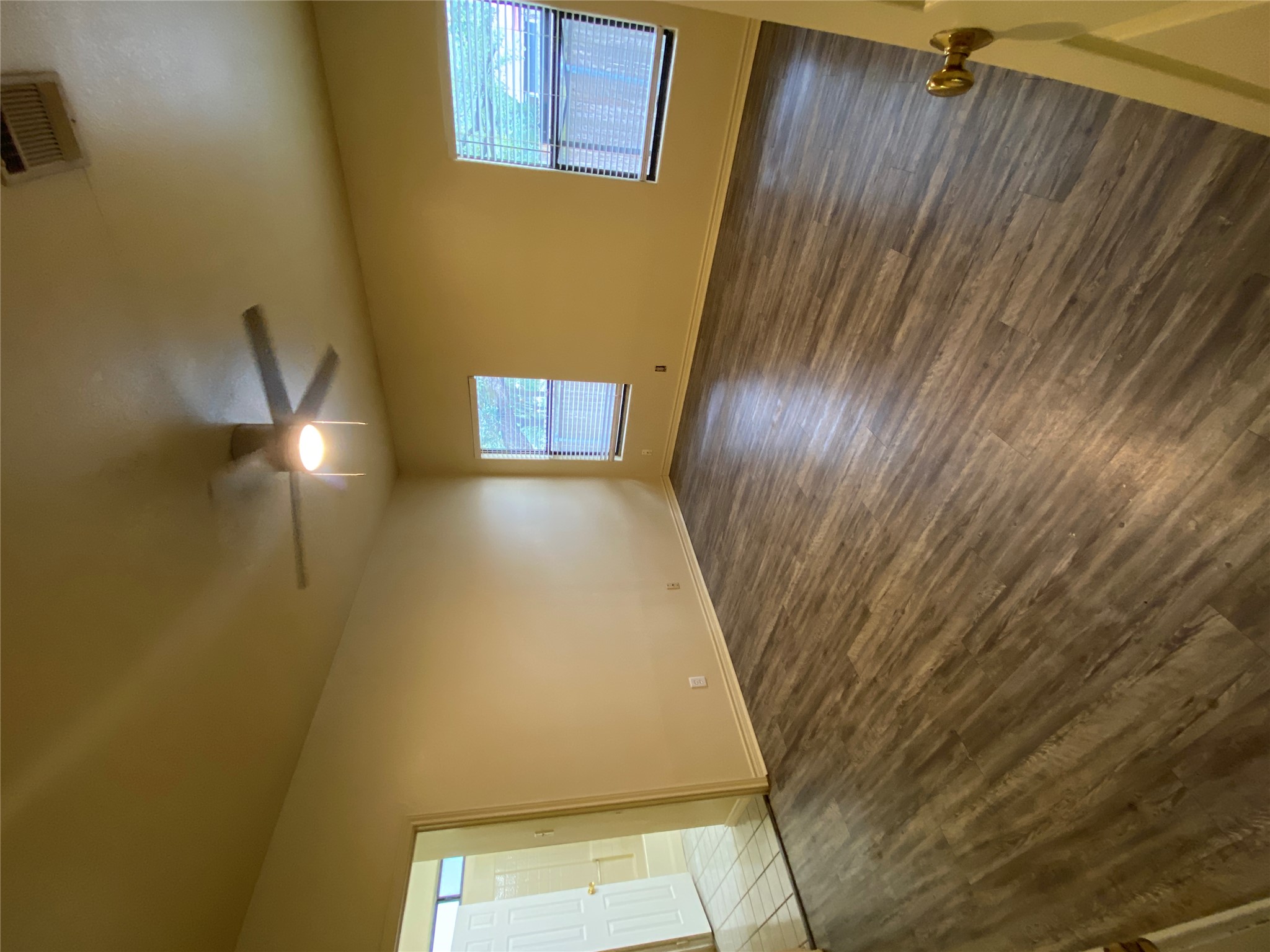 2605 Alcott Lane, Unit B Austin, TX 78748 - Photo 9 of 15 Well-lit living space with durable flooring and natural light, ready for your personal touch.