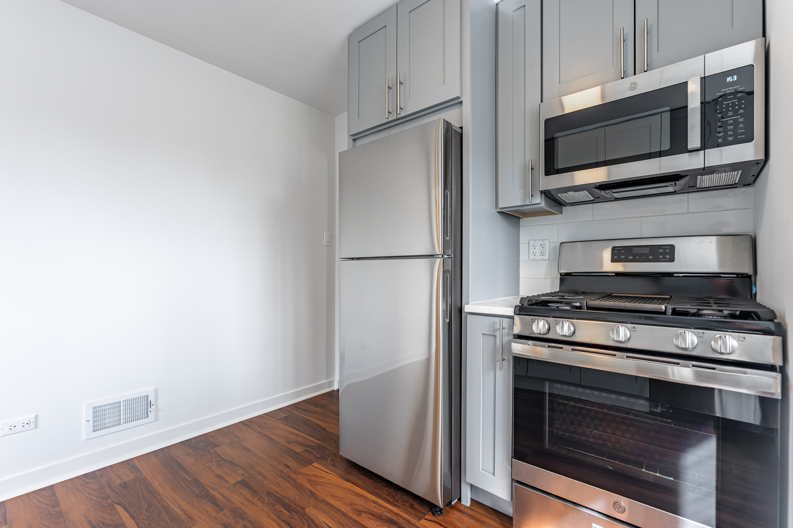 4313 Elm Avenue Lyons, IL 60534 - Photo 11 of 34 a kitchen with a stove and a microwave