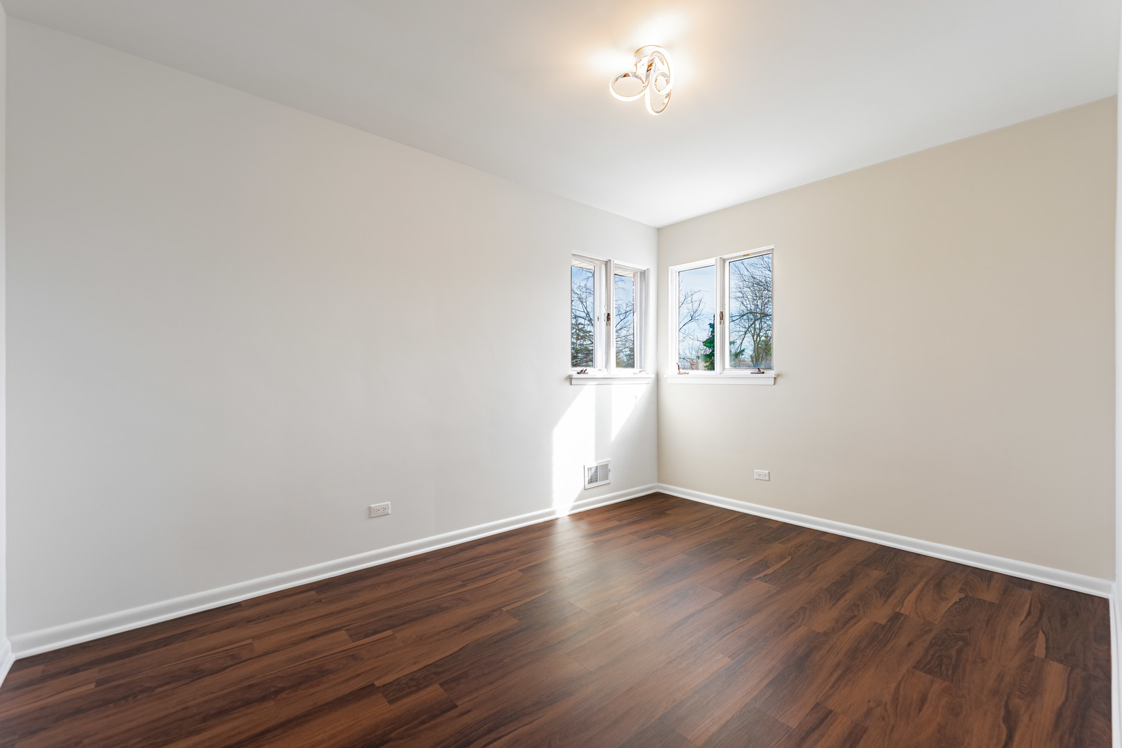 4313 Elm Avenue Lyons, IL 60534 - Photo 12 of 34 wooden floor in an empty room with a window