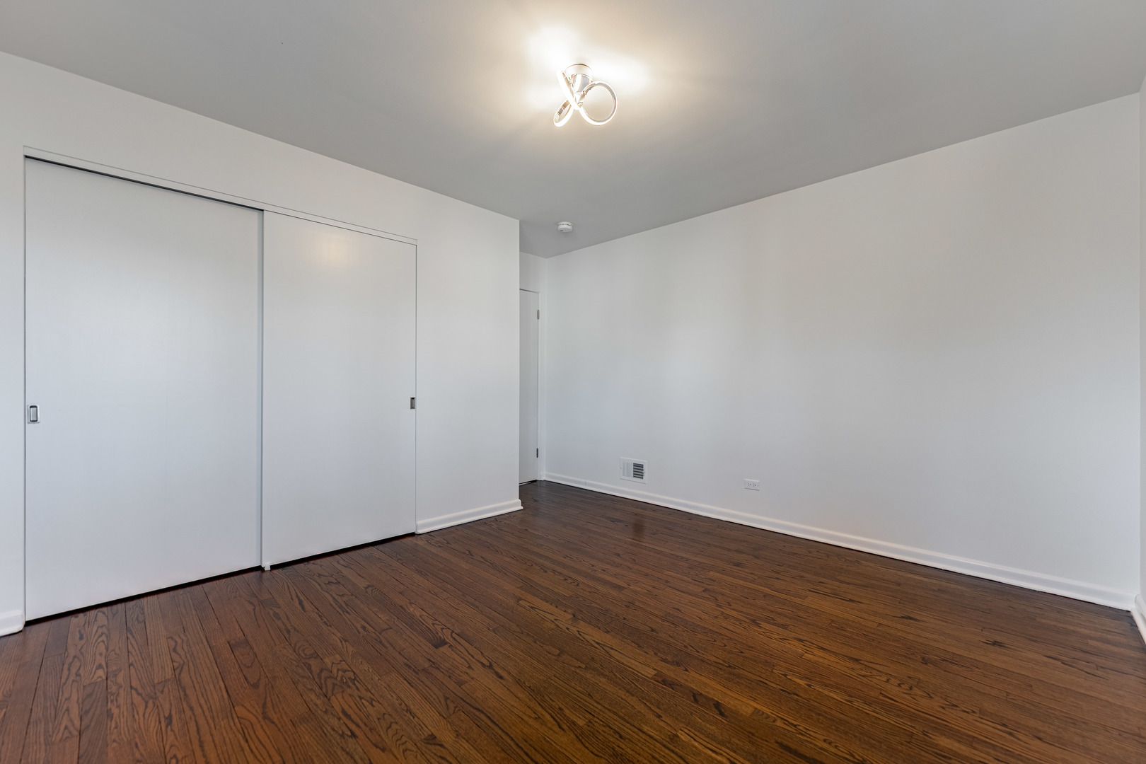 4313 Elm Avenue Lyons, IL 60534 - Photo 15 of 34 a view of an empty room with wooden floor