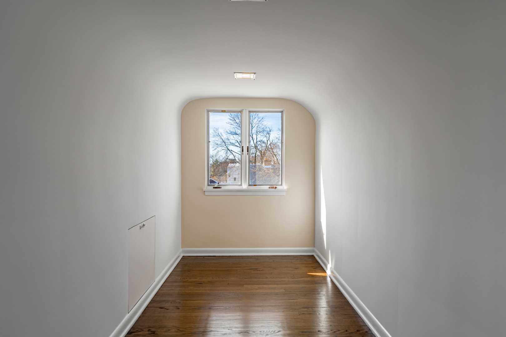 4313 Elm Avenue Lyons, IL 60534 - Photo 20 of 34 an empty room with wooden floor and windows