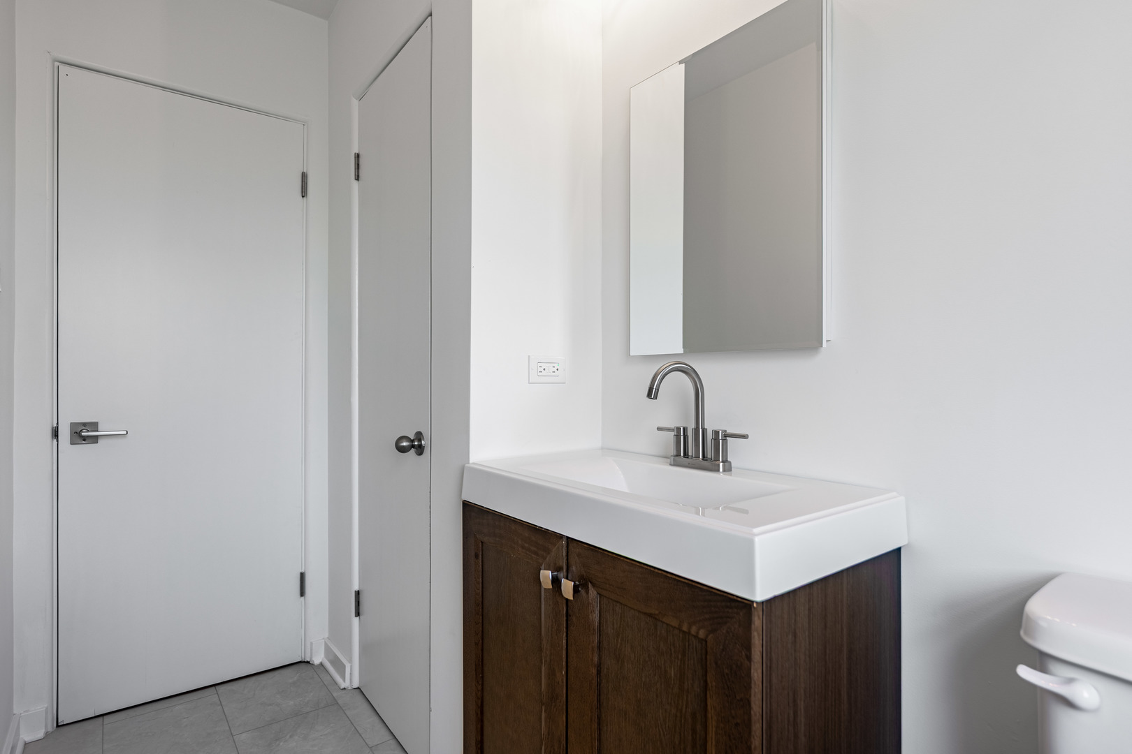4313 Elm Avenue Lyons, IL 60534 - Photo 22 of 34 a bathroom with a sink vanity and a mirror