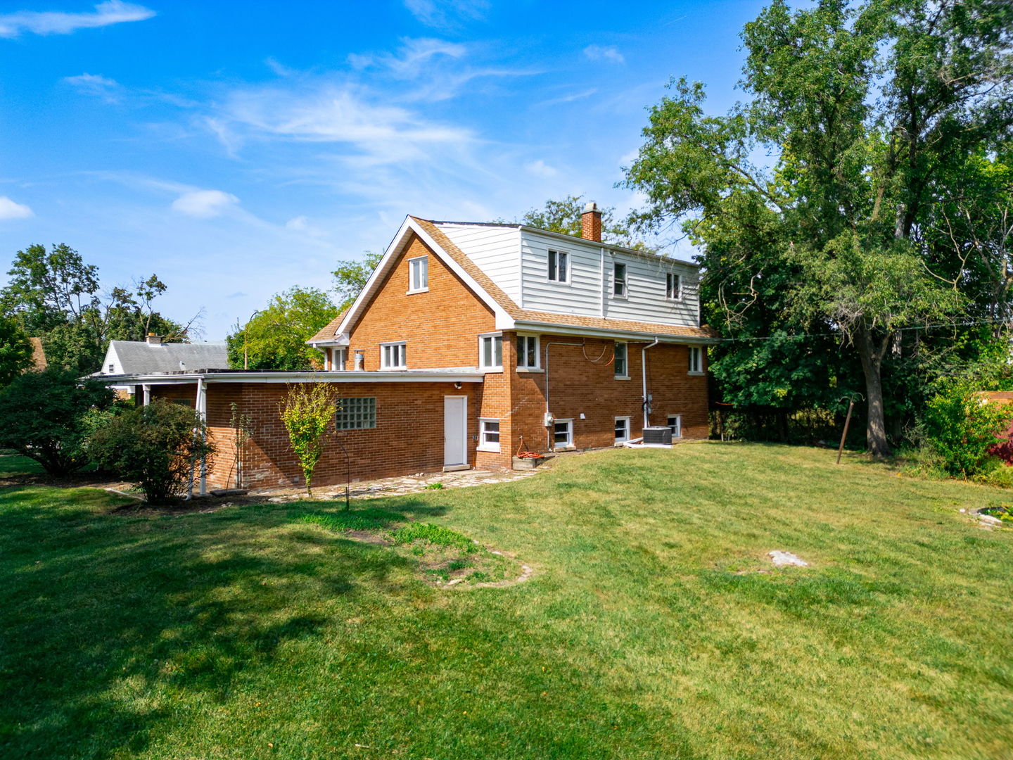 4313 Elm Avenue Lyons, IL 60534 - Photo 31 of 34 a front view of a house with a yard and trees
