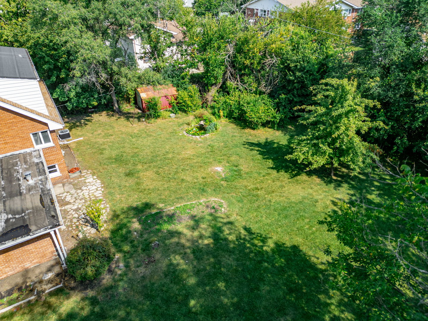 4313 Elm Avenue Lyons, IL 60534 - Photo 32 of 34 a backyard of a house with lots of green space