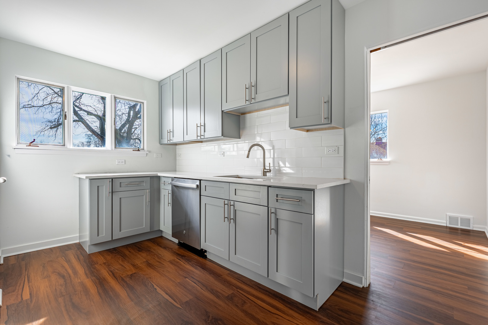 4313 Elm Avenue Lyons, IL 60534 - Photo 9 of 34 a kitchen with a sink cabinets and wooden floor