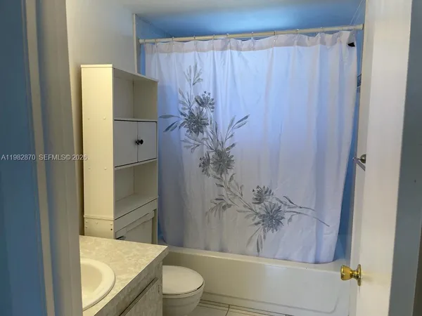 a view of a balcony with furniture