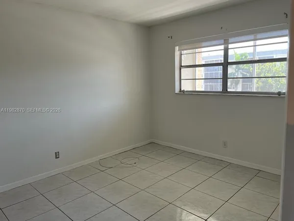 a white refrigerator freezer sitting inside of a kitchen