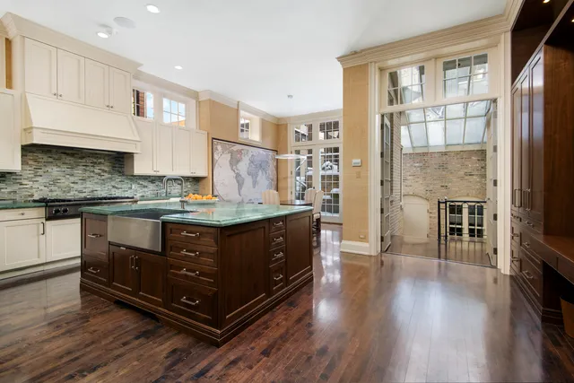 a kitchen with stainless steel appliances granite countertop a stove and a refrigerator