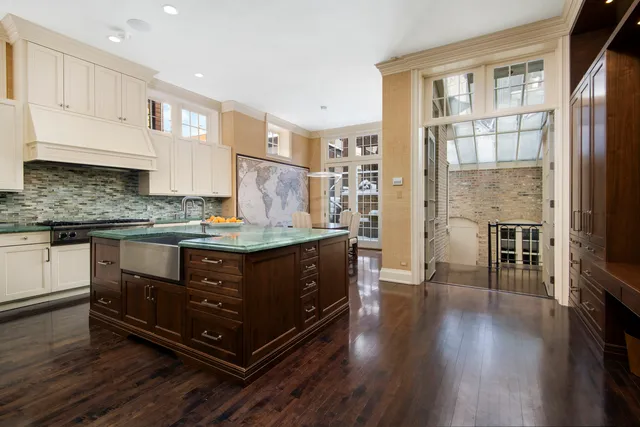 a kitchen with stainless steel appliances granite countertop a stove and a refrigerator