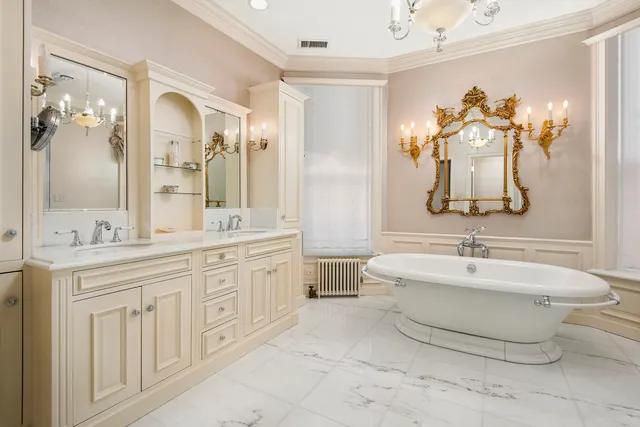 a spacious bathroom with a double vanity sink mirror and