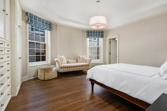 a bedroom with bed and window