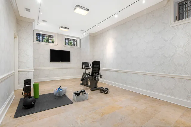 a view of a livingroom with a fireplace and a window