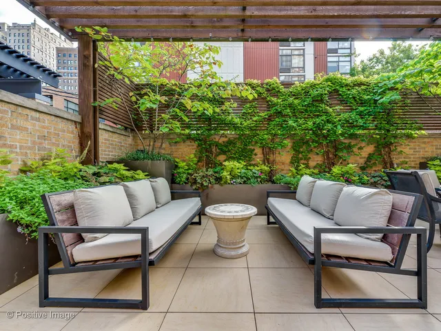 a outdoor living space with furniture and a potted plant
