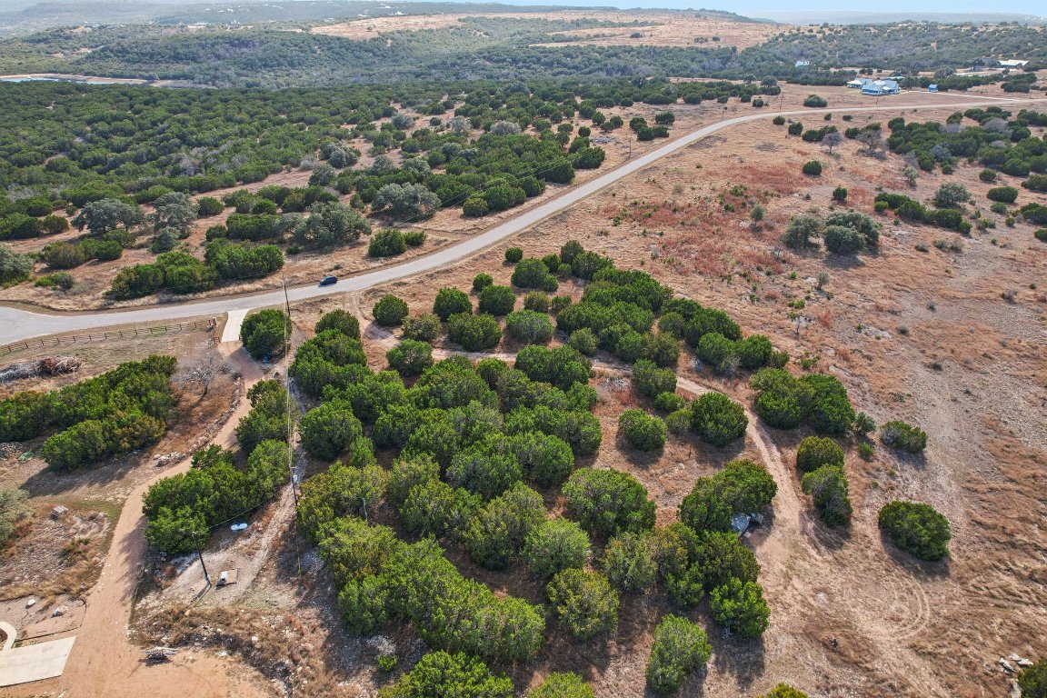 380 Whitetail Ridge Bertram, TX 78605 - Photo 19 of 19 an aerial view of a house with a yard