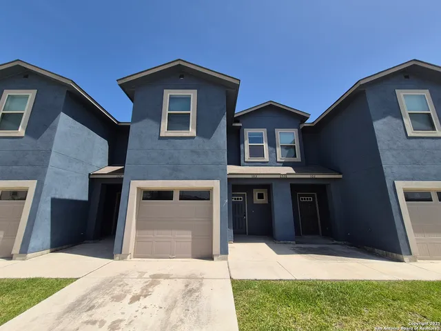 a front view of a house with yard