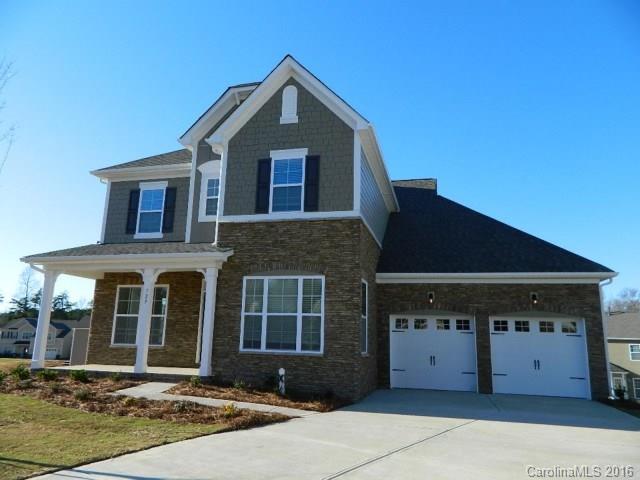 729 Falcon Ridge, Unit HKC109 Fort Mill, SC 29708 - Photo 1 of 12 a front view of a house with a yard