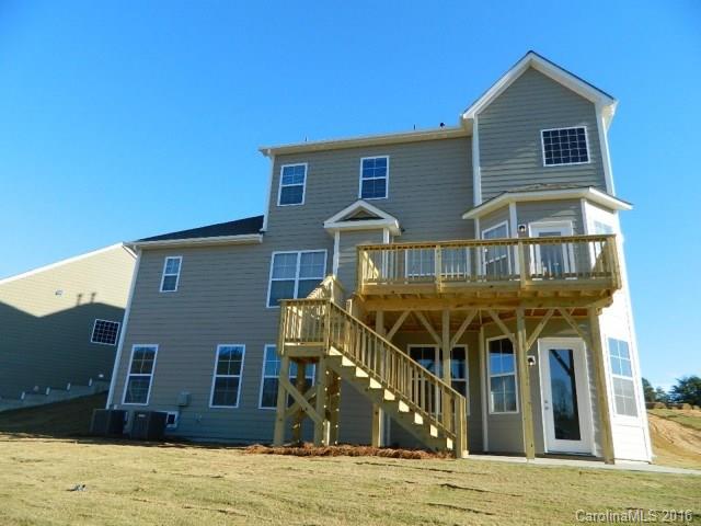 729 Falcon Ridge, Unit HKC109 Fort Mill, SC 29708 - Photo 2 of 12 a front view of a house with a yard