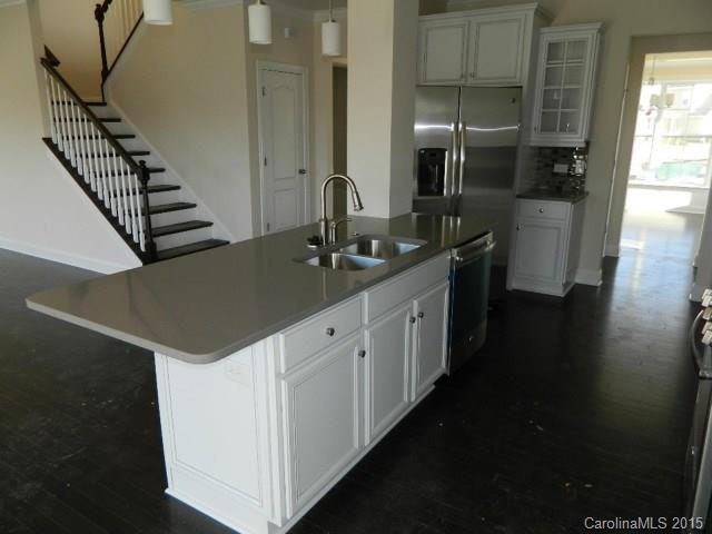 729 Falcon Ridge, Unit HKC109 Fort Mill, SC 29708 - Photo 4 of 12 a kitchen with a sink and cabinets