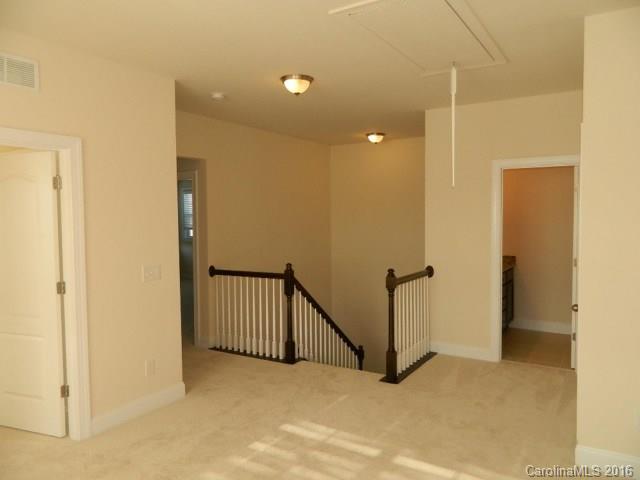 729 Falcon Ridge, Unit HKC109 Fort Mill, SC 29708 - Photo 8 of 12 a view of a hallway with a door