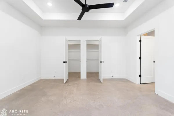 a view of an empty room with a fireplace and a large window