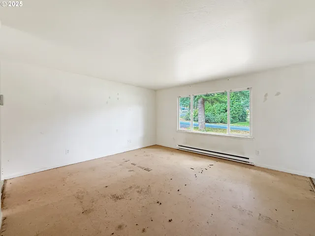 a bathroom with a granite countertop shower a toilet and a sink
