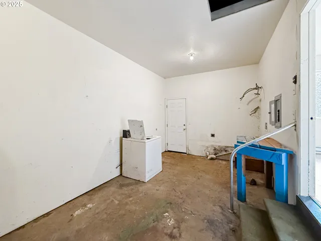 a kitchen with stainless steel appliances a refrigerator sink and cabinets